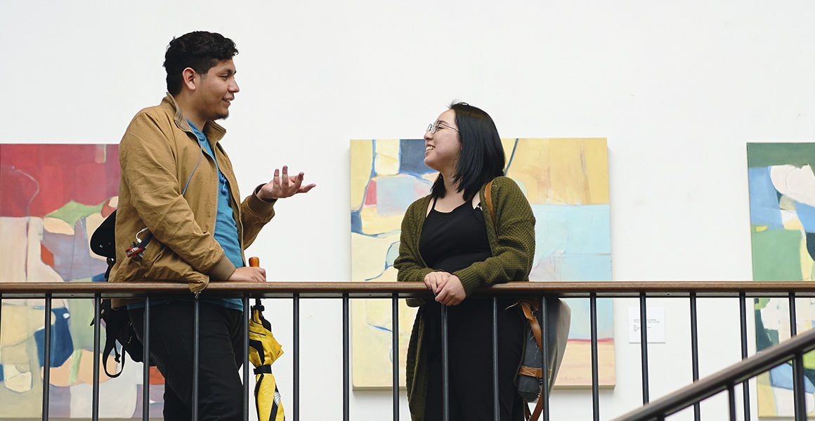 students talking in a gallery