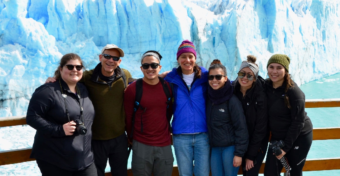 students in front of an iceberg in patagonia