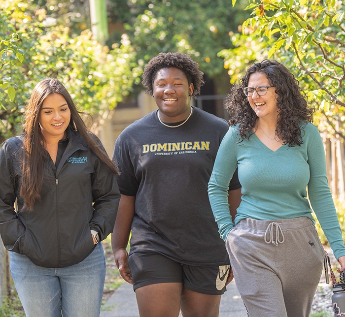 Three students walking together on the Dominican campus.