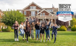 students jumping up in front of meadowlands with the U.S. News badge on the top right corner for Best Regional College West