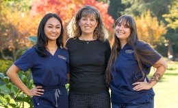 professor and two students in scrubs. 