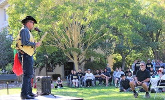 Man playing the guitar at an outdoor concert at Dominican University of California